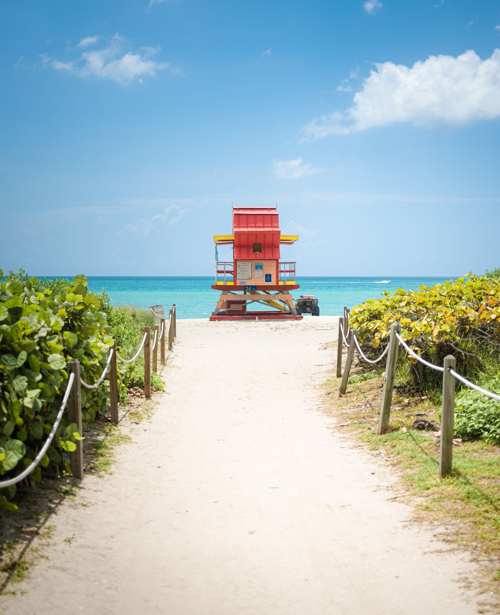 Path through the dunes to a red Miami Beach lifeguard tower