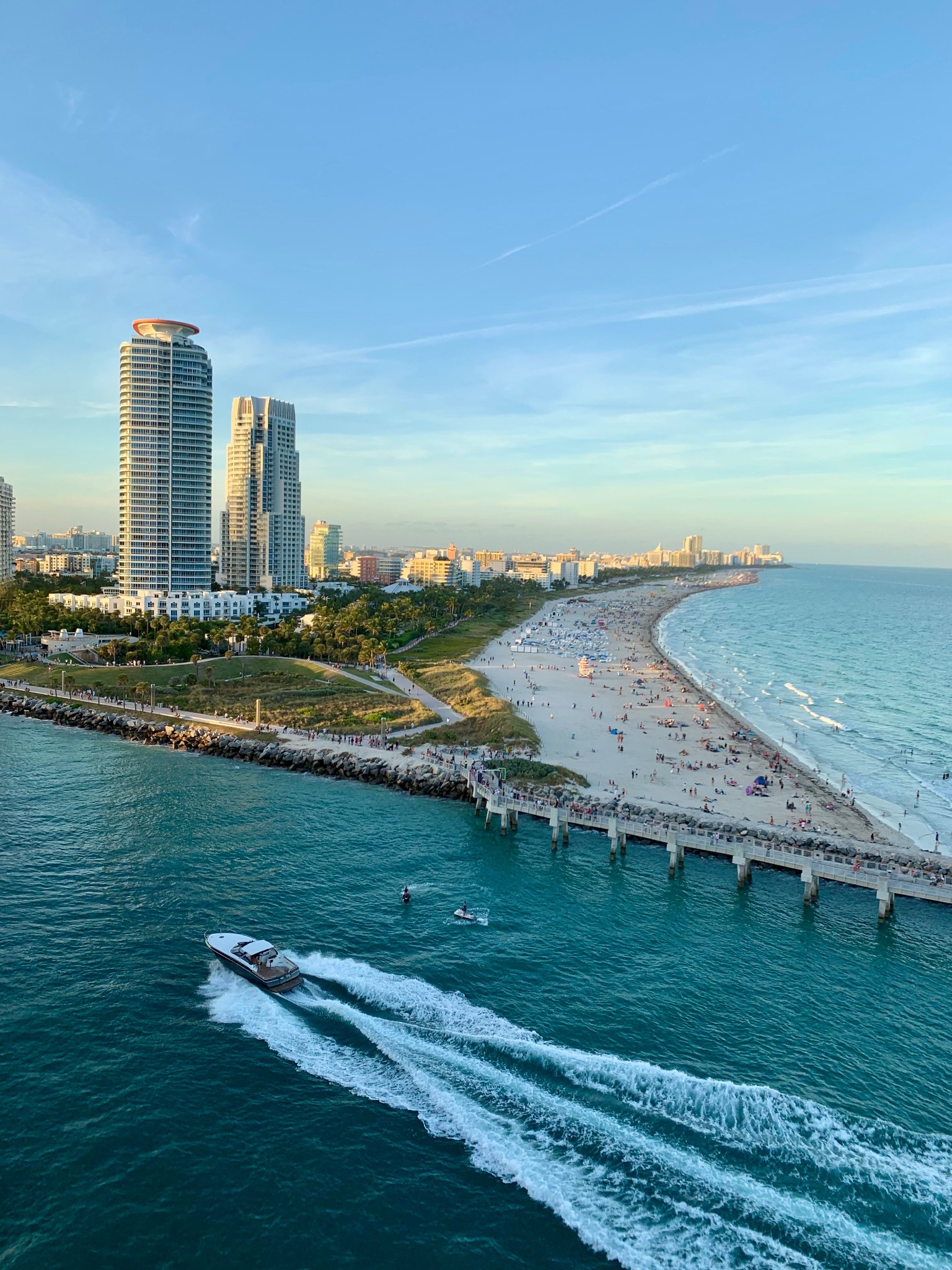 Boat passing South Pointe with the Miami Beach shoreline beyond